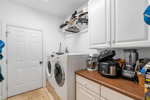 14029 Azalea Dr, Seneca, SC 29678 - laundry room featuring cabinet space, light tile patterned floors, and independent washer and dryer