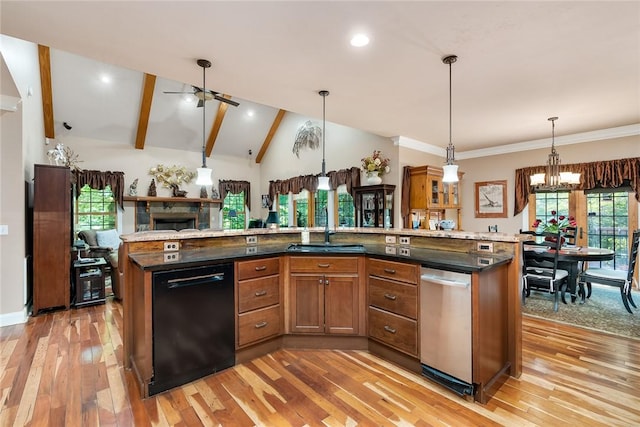 14029 Azalea Dr, Seneca, SC 29678 - kitchen with stainless steel dishwasher, light wood-type flooring, black dishwasher, a sink, and vaulted ceiling with beams