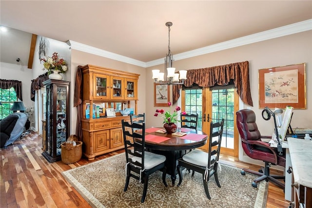 14029 Azalea Dr, Seneca, SC 29678 - dining space with crown molding, light wood finished floors, and an inviting chandelier