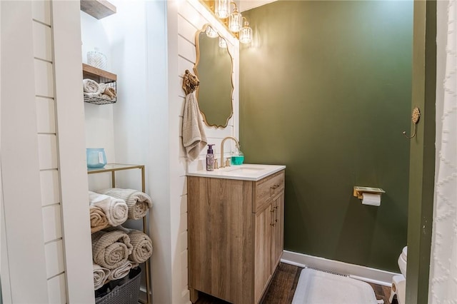 bathroom with vanity and toilet