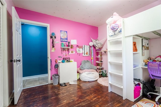 bedroom with wood finished floors