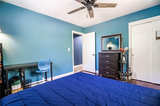 bedroom with a closet, a ceiling fan, and wood finished floors