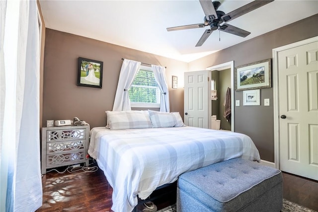 bedroom featuring ceiling fan and dark wood finished floors
