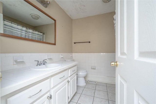 204 Clarke Stream Dr, Anderson, SC 29621 - full bathroom featuring toilet, tile walls, vanity, wainscoting, and tile patterned floors
