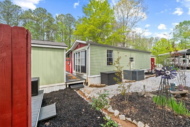 215 Newbury Cir, Westminster, SC 29693 - view of side of home featuring a deck, central air condition unit, and an outbuilding