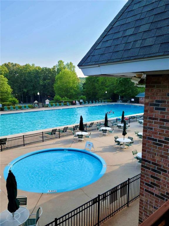 215 Newbury Cir, Westminster, SC 29693 - community pool with a patio and fence