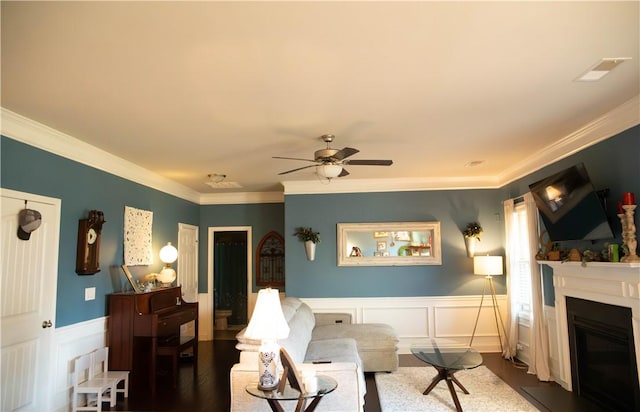 24 Dunsborough Dr, Simpsonville, SC 29680 - living room featuring wood finished floors, visible vents, a ceiling fan, and wainscoting