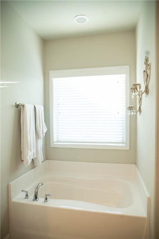 24 Dunsborough Dr, Simpsonville, SC 29680 - full bath featuring a garden tub and a healthy amount of sunlight