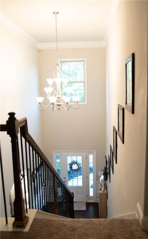 24 Dunsborough Dr, Simpsonville, SC 29680 - entrance foyer with an inviting chandelier, ornamental molding, and plenty of natural light