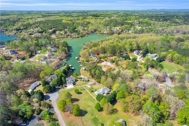 bird's eye view featuring a water view and a view of trees