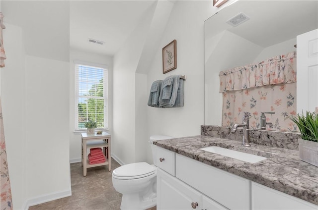 full bathroom featuring toilet, baseboards, and visible vents