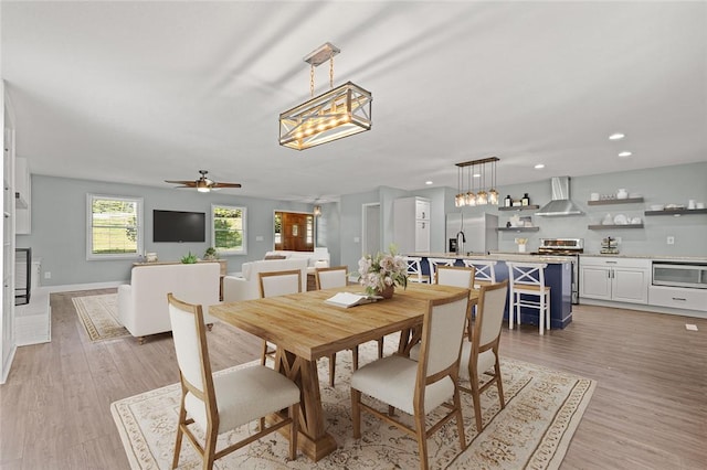 dining area with recessed lighting, light wood finished floors, baseboards, and ceiling fan