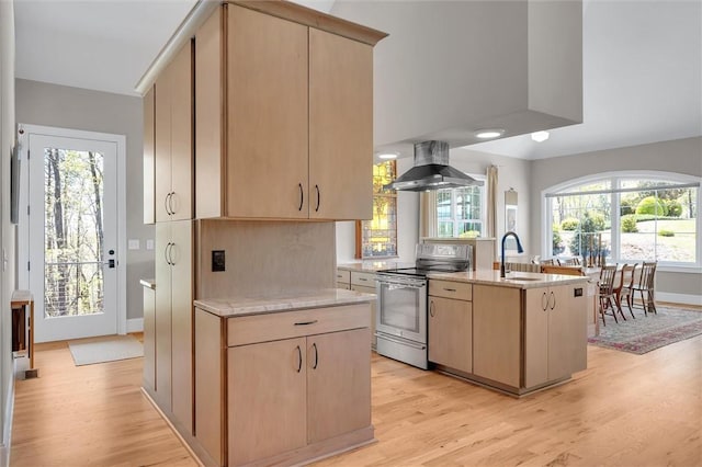 101 Cabernet Way, Travelers Rest, SC 29690 - kitchen featuring wall chimney exhaust hood, light wood-style floors, electric range, and light brown cabinets