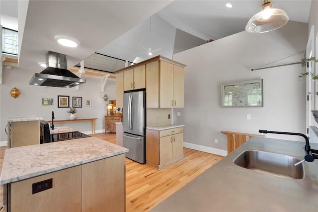 101 Cabernet Way, Travelers Rest, SC 29690 - kitchen with a sink, light brown cabinets, wall chimney exhaust hood, light wood-style flooring, and freestanding refrigerator