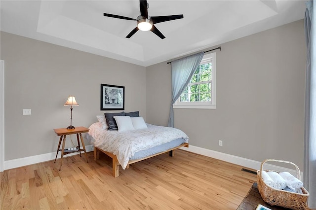 101 Cabernet Way, Travelers Rest, SC 29690 - bedroom with baseboards, a raised ceiling, ceiling fan, and light wood finished floors