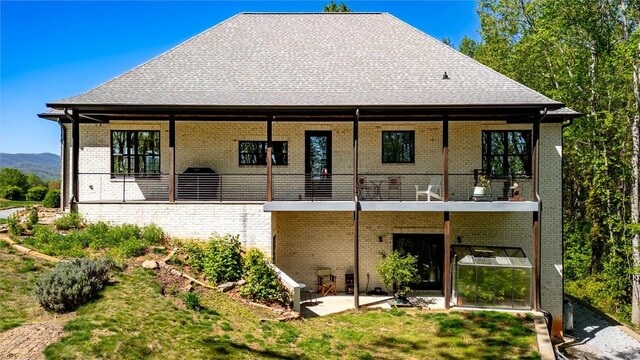 101 Cabernet Way, Travelers Rest, SC 29690 - rear view of property with a lawn, a balcony, a patio, and brick siding