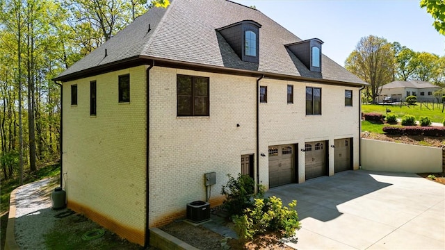 101 Cabernet Way, Travelers Rest, SC 29690 - view of property exterior with roof with shingles, concrete driveway, brick siding, and an attached garage
