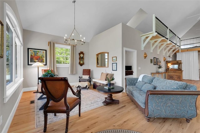 101 Cabernet Way, Travelers Rest, SC 29690 - interior space featuring baseboards, high vaulted ceiling, wood finished floors, and a notable chandelier