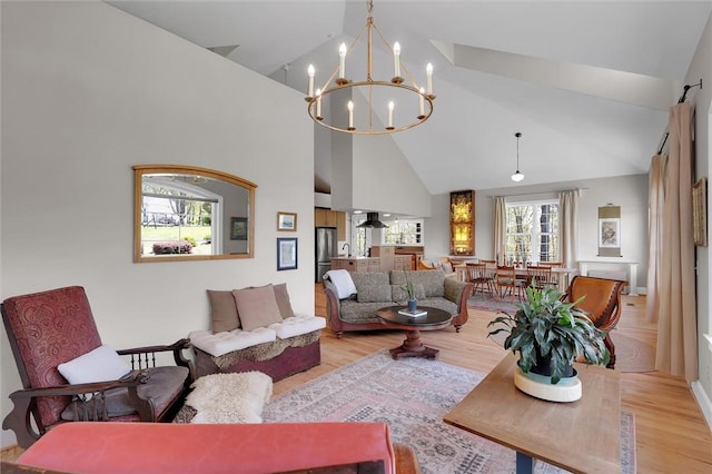 101 Cabernet Way, Travelers Rest, SC 29690 - living area featuring a chandelier, high vaulted ceiling, and wood finished floors