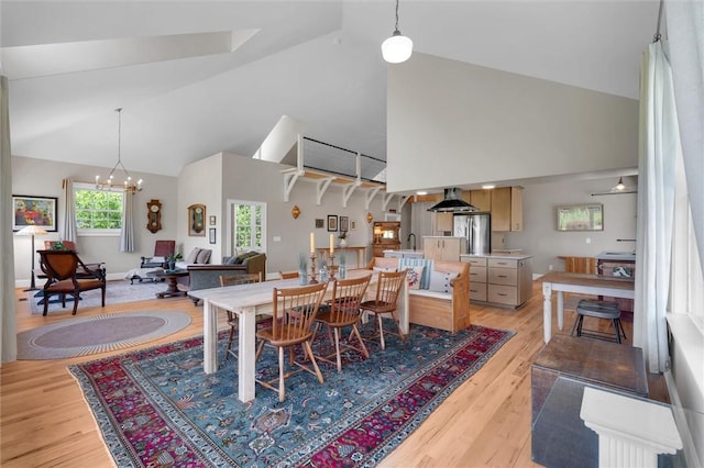 101 Cabernet Way, Travelers Rest, SC 29690 - dining space featuring a chandelier, light wood-type flooring, and high vaulted ceiling