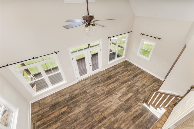 217 Jackson Rd, Iva, SC 29655 - unfurnished living room with high vaulted ceiling, wood finished floors, ceiling fan, french doors, and baseboards