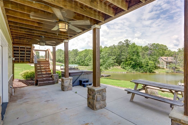 217 Jackson Rd, Iva, SC 29655 - view of patio featuring stairway, a hot tub, ceiling fan, and a water view