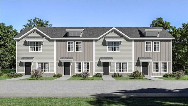 view of front of house with board and batten siding and stone siding