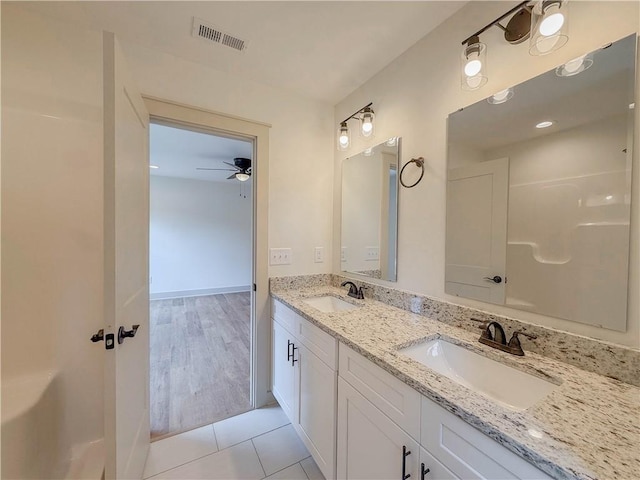 full bath with ceiling fan, tile patterned floors, and double vanity