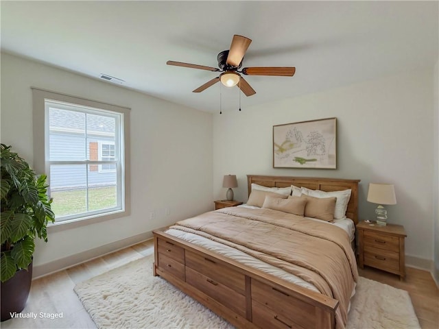 bedroom with baseboards and a ceiling fan