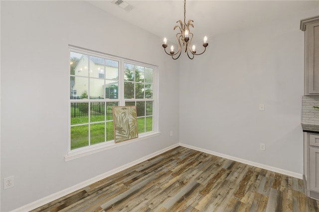101 Pin Oak Ct, Easley, SC 29642 - unfurnished dining area featuring baseboards, a notable chandelier, visible vents, and wood finished floors