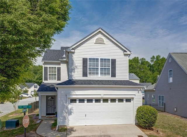 101 Pin Oak Ct, Easley, SC 29642 - traditional-style house with fence, a shingled roof, an attached garage, and driveway
