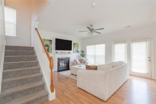 118 Easy Gap Rd, Anderson, SC 29621 - living area with a ceiling fan, stairs, a fireplace with flush hearth, plenty of natural light, and crown molding