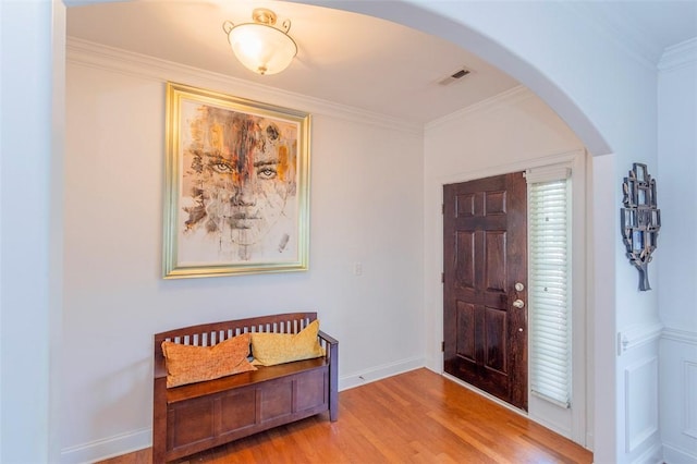 118 Easy Gap Rd, Anderson, SC 29621 - foyer entrance with arched walkways, light wood finished floors, crown molding, and baseboards