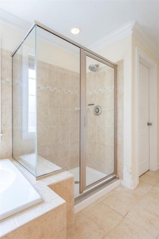 118 Easy Gap Rd, Anderson, SC 29621 - full bathroom featuring ornamental molding, a bath, a shower stall, and tile patterned flooring