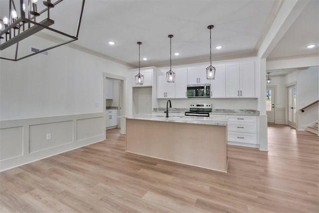 138 Jackson Cir, Anderson, SC 29625 - kitchen featuring light stone counters, a sink, stainless steel appliances, a center island with sink, and white cabinets
