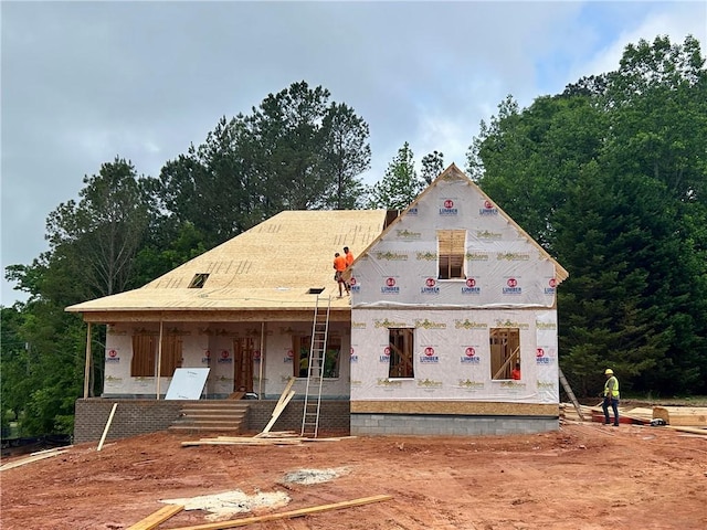 unfinished property with covered porch