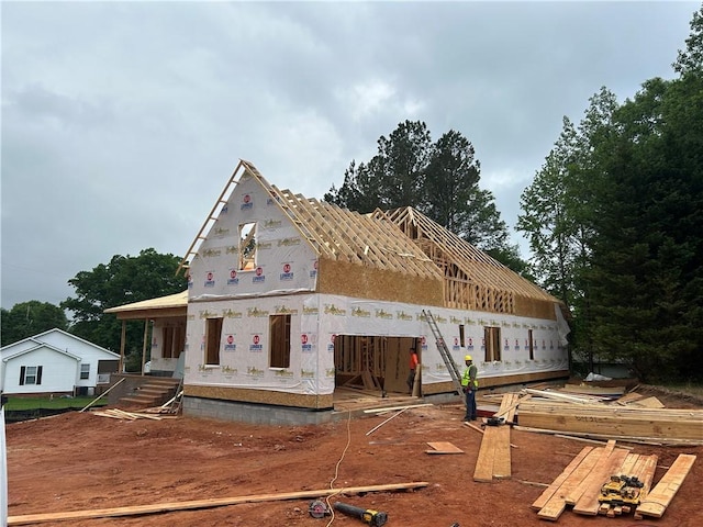 property under construction with covered porch