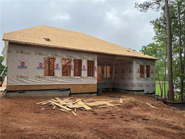 rear view of property with crawl space
