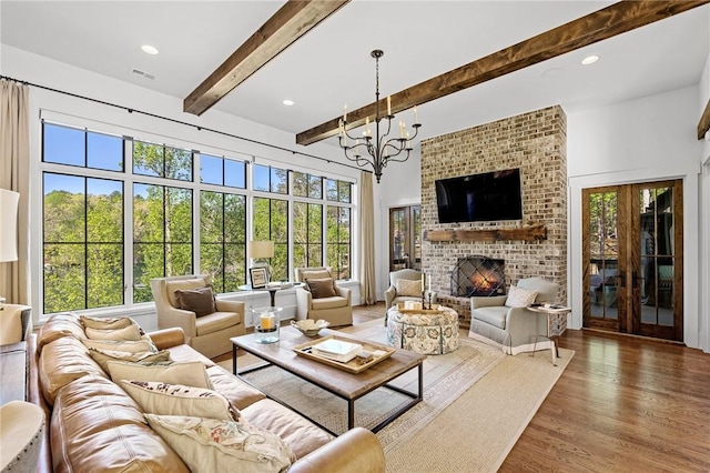 211 Quay Ct, Sunset, SC 29685 - living room with wood finished floors, a healthy amount of sunlight, and beam ceiling