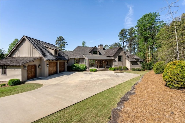 211 Quay Ct, Sunset, SC 29685 - view of front of house with an attached garage, driveway, and board and batten siding