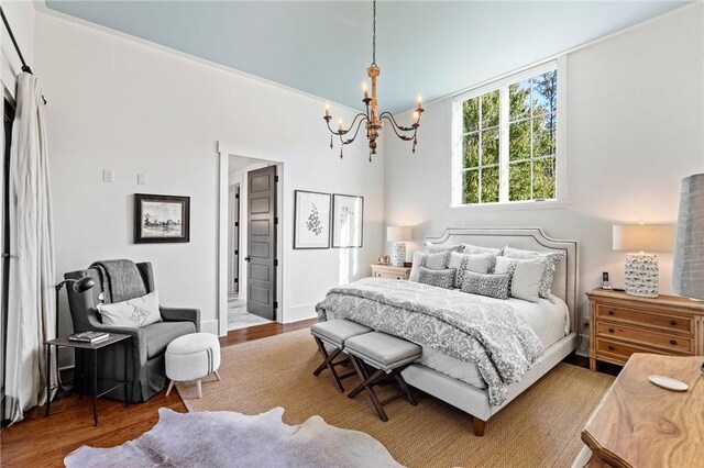 211 Quay Ct, Sunset, SC 29685 - bedroom with wood finished floors and an inviting chandelier