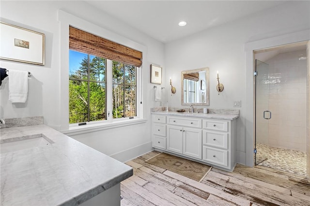 211 Quay Ct, Sunset, SC 29685 - bathroom with a stall shower, a sink, and a healthy amount of sunlight