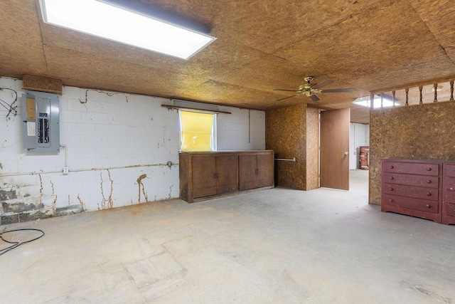 221 Lakeview Dr, Liberty, SC 29657 - interior space featuring electric panel, concrete flooring, ceiling fan, and concrete block wall