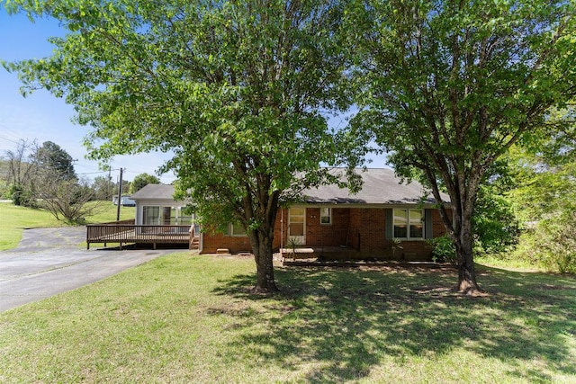 221 Lakeview Dr, Liberty, SC 29657 - view of front facade with a front lawn, brick siding, a deck, and driveway