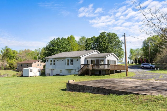 221 Lakeview Dr, Liberty, SC 29657 - back of house featuring a yard, a storage unit, an outbuilding, and a deck