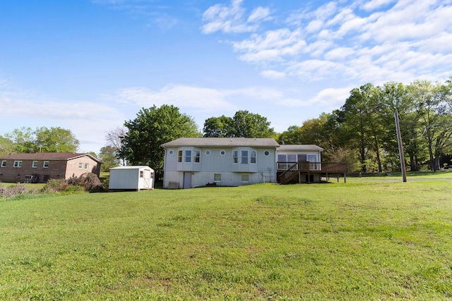 221 Lakeview Dr, Liberty, SC 29657 - rear view of property featuring an outdoor structure, a lawn, a shed, and a wooden deck