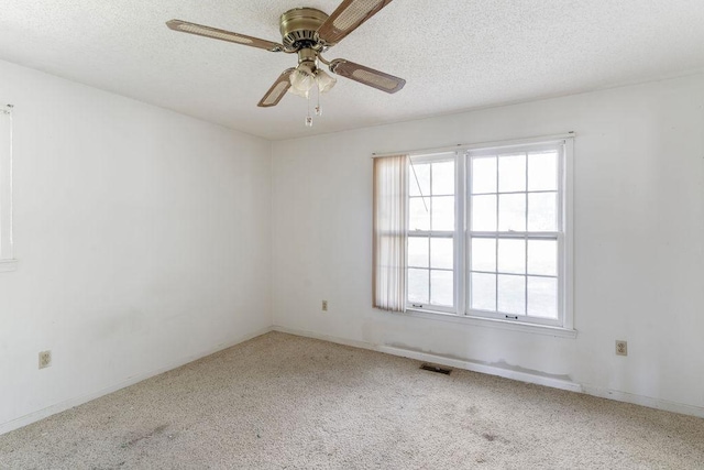 221 Lakeview Dr, Liberty, SC 29657 - carpeted spare room featuring visible vents, a wealth of natural light, a textured ceiling, and ceiling fan
