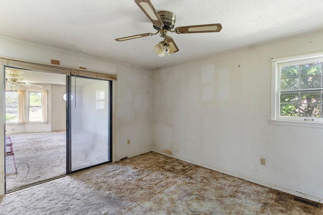 221 Lakeview Dr, Liberty, SC 29657 - carpeted empty room featuring a textured ceiling, visible vents, and ceiling fan