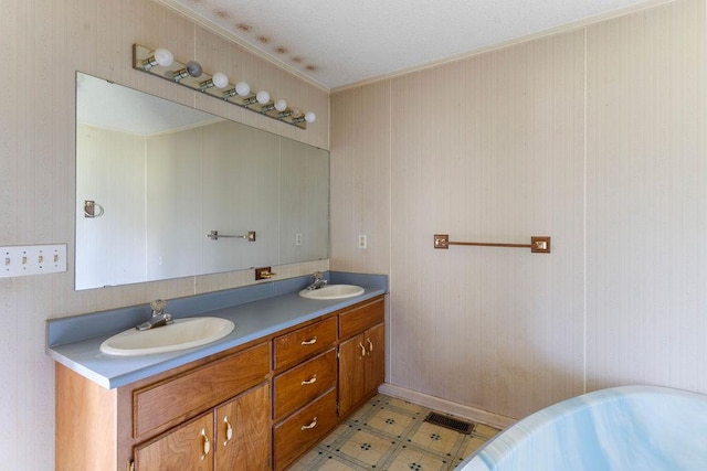 221 Lakeview Dr, Liberty, SC 29657 - full bath featuring double vanity, a freestanding tub, ornamental molding, and a sink