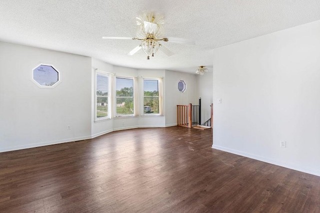 221 Lakeview Dr, Liberty, SC 29657 - unfurnished living room with dark wood-type flooring, a textured ceiling, baseboards, and ceiling fan